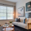 living room with a large window and open spaces