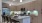 a kitchen with a marble counter top