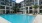 a pool in a courtyard between buildings